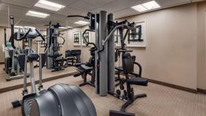 a gym with several tread machines in a room at Best Western DuBois Hotel in DuBois