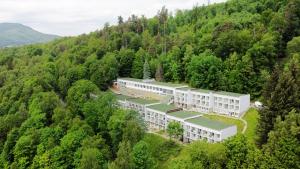 an aerial view of a building in the middle of a forest at Barbara 12 in Ustroń