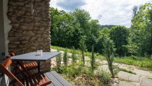 a table and chairs on the porch of a house at Barbara 12 in Ustroń +9 photos