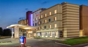 a hotel building with a parking meter in front of it at Fairfield by Marriott Ahmedabad in Ahmedabad