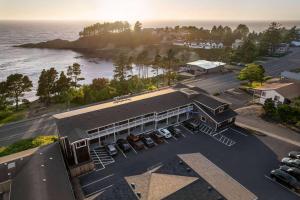 an aerial view of a building with a parking lot at Travelodge by Wyndham Depoe Bay in Depoe Bay
