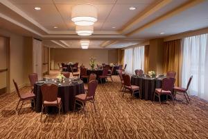 a conference room with tables and chairs in a room at Hilton Garden Inn Downtown Dallas in Dallas