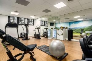 a gym with several exercise bikes in a room at NH City Centre Amsterdam in Amsterdam