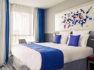 Katil atau katil-katil dalam bilik di Mercure Toulouse Sud