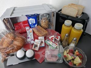 a lunch box with food and bread and drinks at Guesthouse KST in Zandvoort