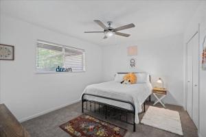 a bedroom with a bed with a stuffed animal on it at Small Town, Big House - Sleeps 8! in Taylor