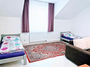 Katil atau katil-katil dalam bilik di Comenius Apartments - Apartmány na rohu