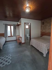 Postel nebo postele na pokoji v ubytování Villa Chalés - andar superior