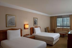 Voodi või voodid majutusasutuse Radisson Blu Martinez Beirut toas