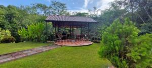 a gazebo in the middle of a yard at Yethan house in Uvita