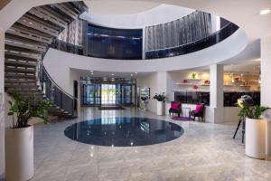 a large lobby with a large elliptical ceiling at Park Inn by Radisson Odintsovo in Odintsovo
