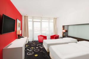 Televízia a/alebo spoločenská miestnosť v ubytovaní Park Inn by Radisson Sarvar Resort & Spa - All Inclusive