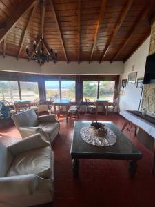 a living room with a couch and a table at Casa Chiozza in San Bernardo