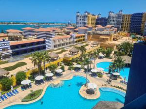 an aerial view of a resort with a pool at Porto marina in El Alamein