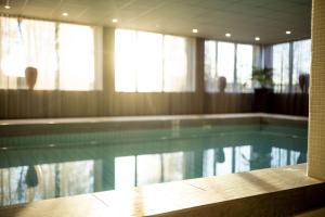 a swimming pool in a hotel room with at Radisson Blu Arlandia Hotel, Stockholm-Arlanda in Arlanda