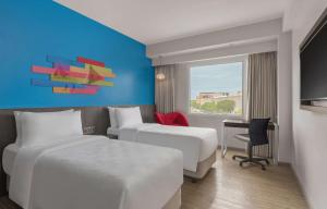 Postel nebo postele na pokoji v ubytování Park Inn By Radisson Iloilo