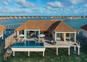 an aerial view of a villa on the water at Radisson Blu Resort Maldives in Fenfushi