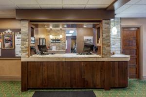 an office lobby with a reception desk with two desks at Bayview Wildwood Resort, Ascend Hotel Collection in Severn