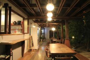a dining room with a table and some chairs at The My Home Resort in Prachuap Khiri Khan