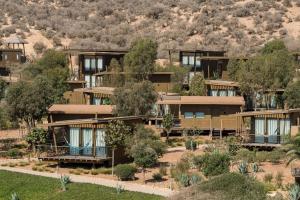 an aerial view of a resort with trees at Radisson Blu Resort Taghazout Bay Surf Village in Taghazout