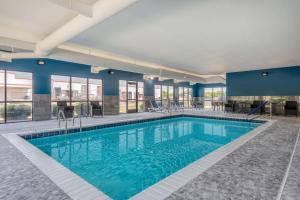a pool in a hotel with blue walls at Hampton Inn New Philadelphia in New Philadelphia