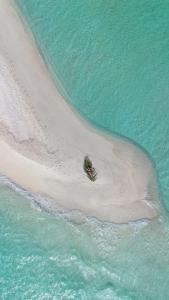 an aerial view of a beach with the ocean at Summer Vibes Beach Front in Rasdhoo