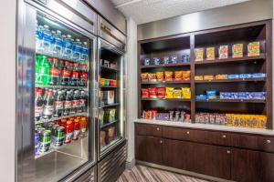 a refrigerator filled with lots of food and drinks at Super 8 by Wyndham The Woodlands North in The Woodlands