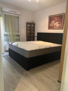Postel nebo postele na pokoji v ubytování L’Alsace autrement