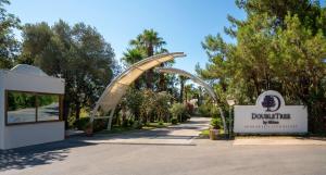 a roller coaster at the entrance to a park at DoubleTree by Hilton Bodrum Isil Club All-Inclusive Resort in Torba