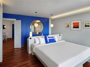 Ein Bett oder Betten in einem Zimmer der Unterkunft HOMM Bliss Southbeach Patong
