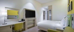 Rúm í herbergi á Hampton By Hilton Doha Old Town