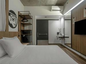Postel nebo postele na pokoji v ubytování ibis Styles Maceió Pajuçara