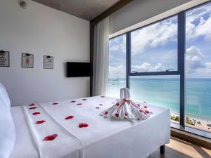 Postel nebo postele na pokoji v ubytování ibis Styles Maceió Pajuçara