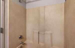 a shower in a bathroom with a shower door at Extended Stay America Suites - Chesapeake - Crossways Blvd in Chesapeake