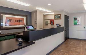 a waiting room with a cell phone on a counter at Extended Stay America Suites - Denver - Tech Center South - Inverness in Centennial