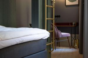 Rúm í herbergi á Hotel Frantz, WorldHotels Crafted