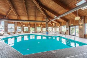 a pool in a large building with a large ceiling at Quality Inn Decatur near US-224 in Decatur