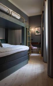 Rúm í herbergi á Hotel Frantz, WorldHotels Crafted