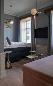 Rúm í herbergi á Hotel Frantz, WorldHotels Crafted