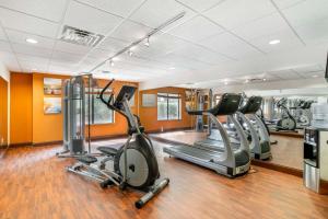 a gym with several treadmills and elliptical machines at Comfort Suites At WestGate Mall in Spartanburg