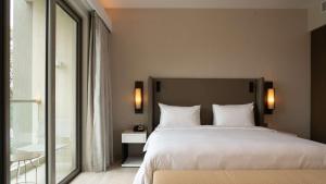 Postel nebo postele na pokoji v ubytování Radisson Blu Hotel & Residence Nairobi Arboretum