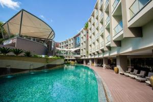 a swimming pool in the middle of a building at Radisson Blu Hotel & Residence Nairobi Arboretum in Nairobi