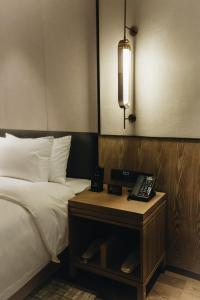 Voodi või voodid majutusasutuse Orienwit Hotel-Free Shuttle Bus fir Canton Fair toas