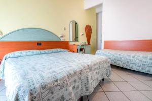 Postel nebo postele na pokoji v ubytování Hotel Diamond