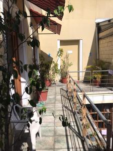 a balcony with potted plants on the side of a building at DON- PABLITo in Quito