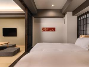 a bedroom with a bed and a tv at MIMARU Kyoto Nishinotoin Takatsuji in Kyoto +44 photos