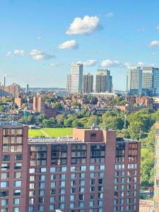 a view of a city skyline with tall buildings at Lux 2BR 2BR BackBay Boston Common T-station in Boston