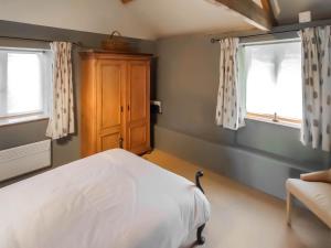 Katil atau katil-katil dalam bilik di Homers Cottage