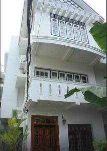 
a large white building with a large window at The Fort Bungalow in Cochin
