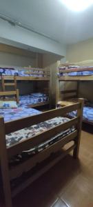 a group of bunk beds in a room at Hospedaje In House in La Merced